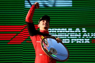 Ferrari's Charles Leclerc celebrates on the podium after winning the Australian Grand Prix. Reuters
