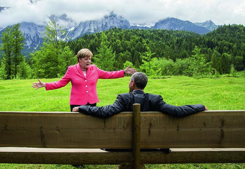 German chancellor Angela Merkel and US president Barack Obama talk during a June meeting in Bavaria. Michael Kappeler / Reuters / June 8, 2015