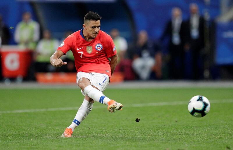 Alexis Sanchez scores the winning penalty in the shootout. Reuters