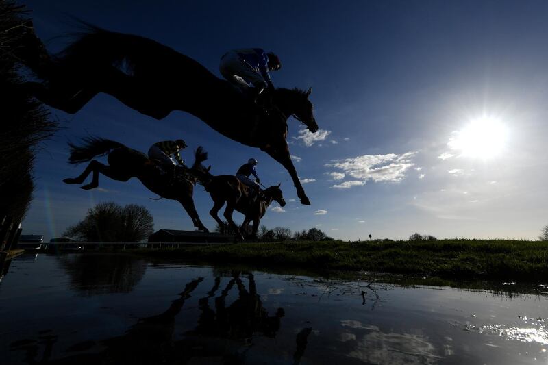 Runners clear the water jump during the SJH Carpets Handicap Steeple Chase at Wincanton Racecourse in Wincanton, England. Getty Images