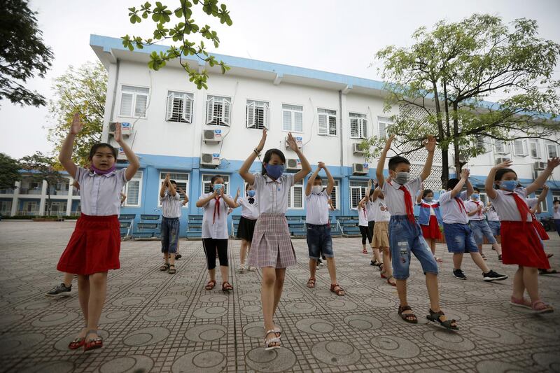 Classse are back in Vietnam with children doing gymnastic exercises in a Hanoi  elementary school.EPA