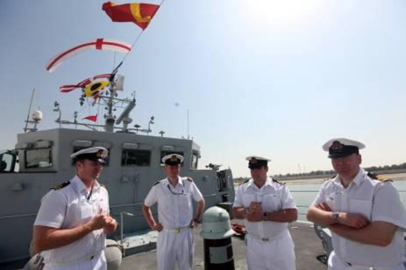 February 20, 2011 / Abu Dhabi / Lt. Ollie Hucker, left, Lt James Walton,  Lt Commander Jeffrey Gulliver and Lt Commander Divid Griffen on board the HMS Pembroke on display part of IDEX in Abu Dhabi February 20, 2011. (Sammy Dallal / The National)