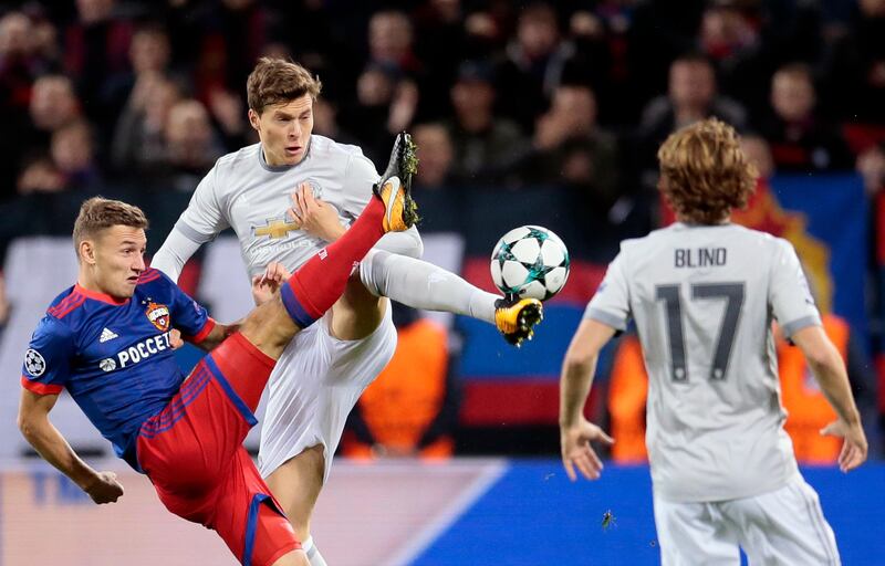 Manchester United's Victor Lindelof challenges CSKA's Fedor Chalov. Ivan Sekretarev / AP Photo