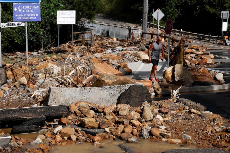 Fallen rocks and debris block a road after a landslide cut off residents of Coalcliff in New South Wales when heavy rain lashed eastern Australia, causing flash flooding and emergency warnings up and down the Pacific coast. AFP