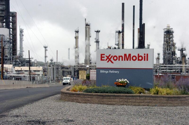 ExxonMobil, Chevron and others may see their ratings cut. Matthew Brown / AP