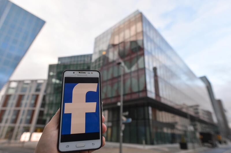 Facebook logo displayed on a mobile phone in front of Facebook EMEA headquarters on Grand Canal Square in Dublin Docklands.
On Friday, 29 January, 2021, in Dublin, Ireland. (Photo by Artur Widak/NurPhoto via Getty Images)
