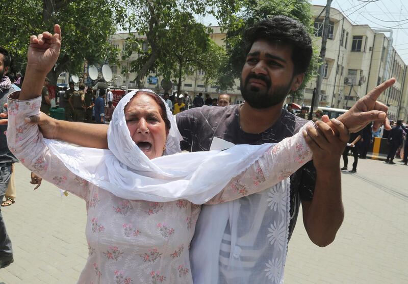 A mother mourns the death of her son outside a hospital in Lahore, Pakistan. A suicide bomber attacked security forces guarding a famous Sufi shrine in Pakistan's eastern city of Lahore, police said. AP Photo
