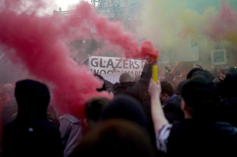 Protesters let off flares outside Old Trafford on Thursday. Getty