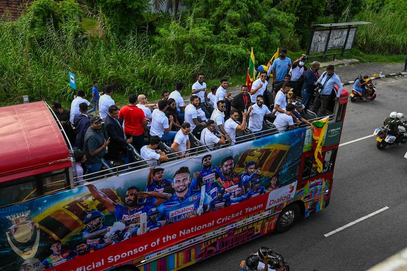 Sri Lankan cricket team travel through the streets of  Colombo during their Asia Cup victory parade. AFP
