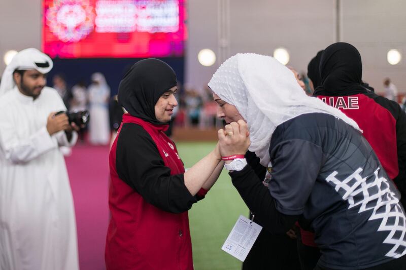 ABU DHABI, UNITED ARAB EMIRATES - March 20 2019.

An woman kisses UAE's bocce athlete Mariam Al Mulla hand, celebrating her gold medal win against Hong Kong at the Special Olympics World Games in ADNEC.

 (Photo by Reem Mohammed/The National)

Reporter: 
Section:  NA