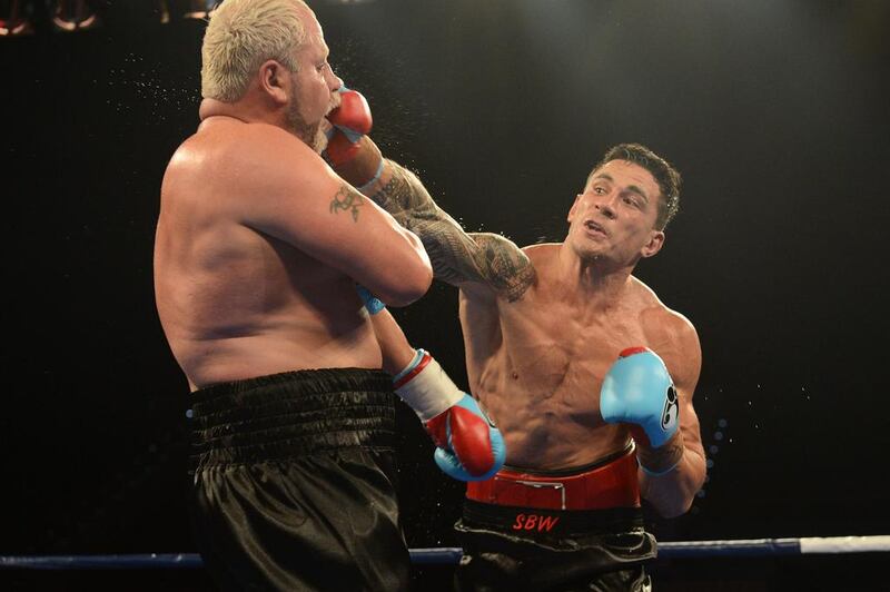 Sonny Bill Williams, right, strikes South African opponent Francois Botha during their World Boxing Association (WBA) heavyweight fight in February 2013. EPA