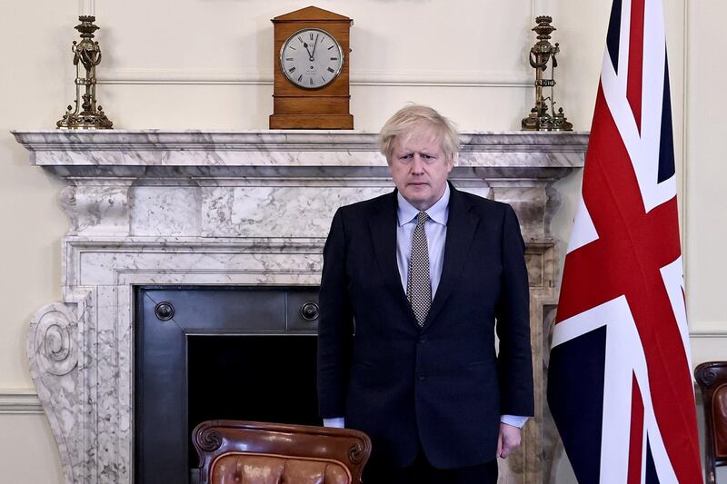 Britain's Prime Minister Boris Johnson observes a two-minute silence in Downing Street to mark the 75th anniversary of VE Day in London. AFP