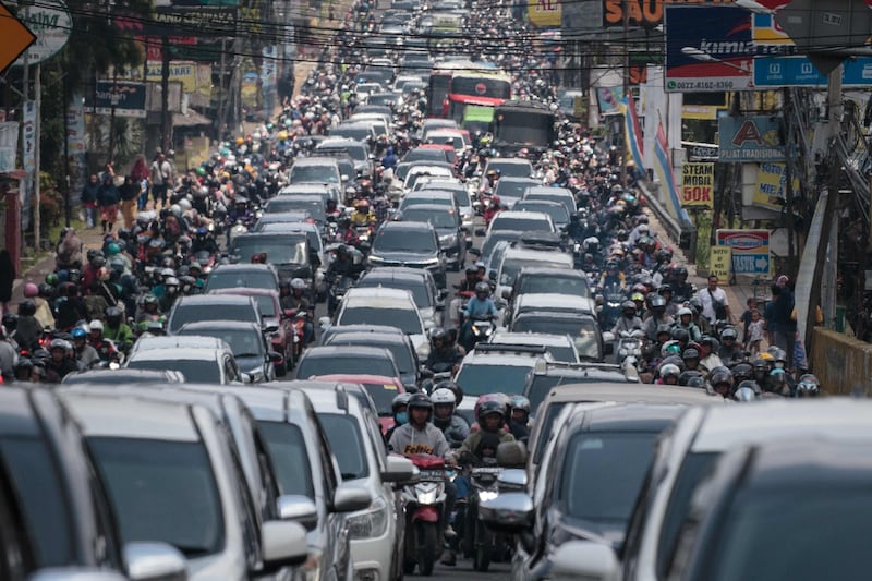 Cars and motorcycles occupy a road on the weekend of the Eid Al Fitr holiday, celebrating the end of Ramadan, in Bogor, West Java. AFP