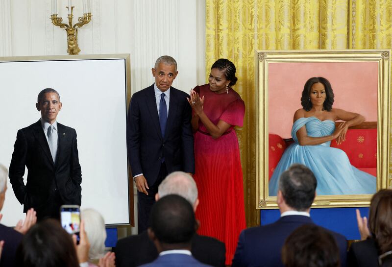 Former US president Barack Obama and former first lady Michelle Obama attend the unveiling of their official White House portraits, painted by Robert McCurdy and Sharon Sprung, respectively, at the White House. Reuters