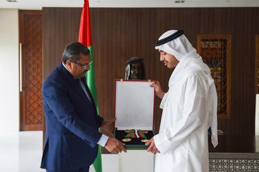 Sheikh Abdullah bin Zayed presents TP Seetharam the Independence Order. Wamا