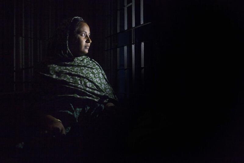 Rawshan Ara, 28, poses at her home. Suvra Kanti Das / AFP