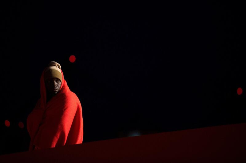 A migrant waits to be transferred at Malaga's harbour after an inflatable boat carrying 254 migrants was rescued by the Spanish coastguard. AFP