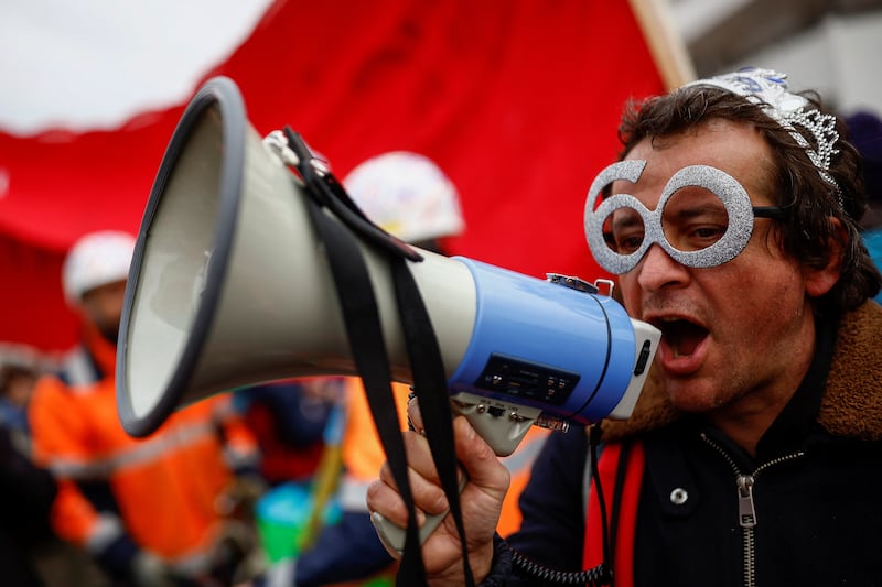 A protester attends a demonstration against the French government's pension reform plan, in Saint-Nazaire. Reuters