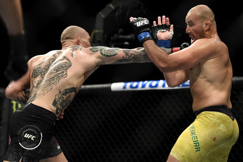 Anthony Smith (L) of the United States fights Glover Teixeira (R) of Brazil in their light heavyweight bout during UFC Fight Night. AFP