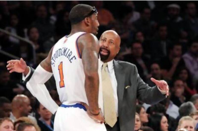 New York Knicks head coach Mike Woodson, right, talks to Amare Stoudemire during the first half of their game against the Philadelphia 76ers on Sunday. The Knicks won, 99-93. Mary Altaffer / AP Photo