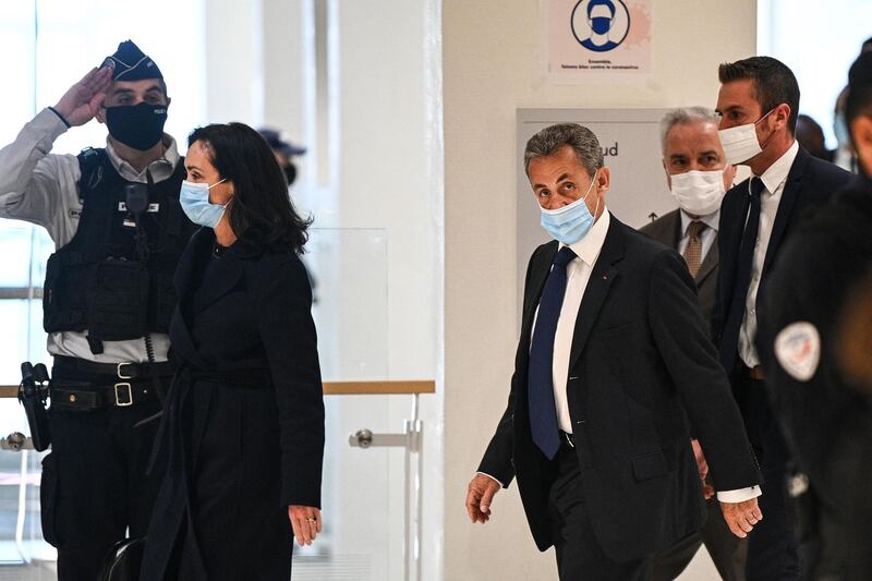 Former French president Nicolas Sarkozy arrives at the Paris court house to hear the final verdict in a corruption trial. AFP