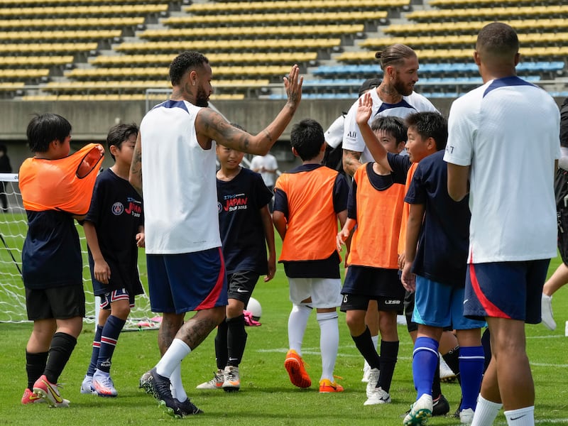 PSG players Neymar, Sergio Ramos and Kylian Mbappe greet kids during the PSG kids soccer clinic in Tokyo, Japan. EPA