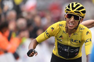 Colombia's Egan Bernal, wearing the overall leader's yellow jersey, celebrates as he crosses the finish line of the 20th stage of the 106th edition of the Tour de France in Val Thorens. AFP