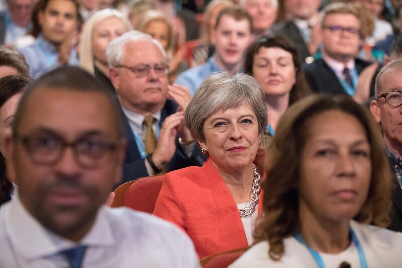 Theresa May, U.K. prime minister, reacts as she sits in audience during the Conservative Party annual conference in Birmingham, U.K., on Sunday, Sept. 30, 2018. May is battling to assert her authority as U.K. prime minister after a disastrous start to her party’s annual conference threatened to explode into a full-blown leadership crisis. Photographer: Chris Ratcliffe/Bloomberg