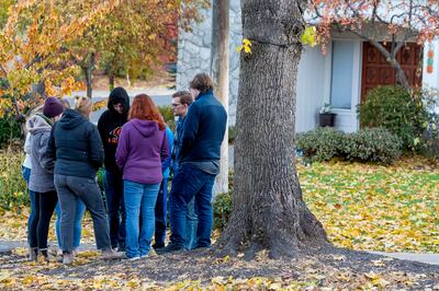 People gather to pray at the University of Idaho after four students were found dead. AP