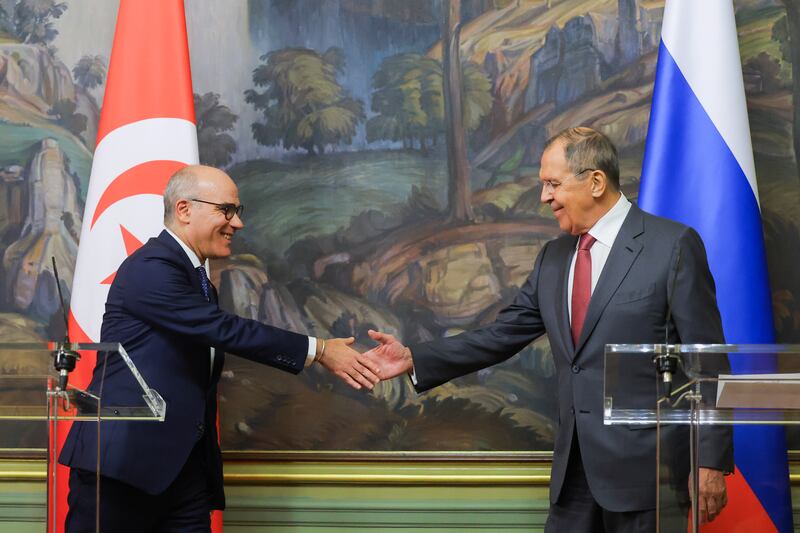 Russian Foreign Minister Sergey Lavrov, right, shakes hands with Tunisian counterpart Nabil Ammar after a meeting in Moscow on Tuesday. EPA