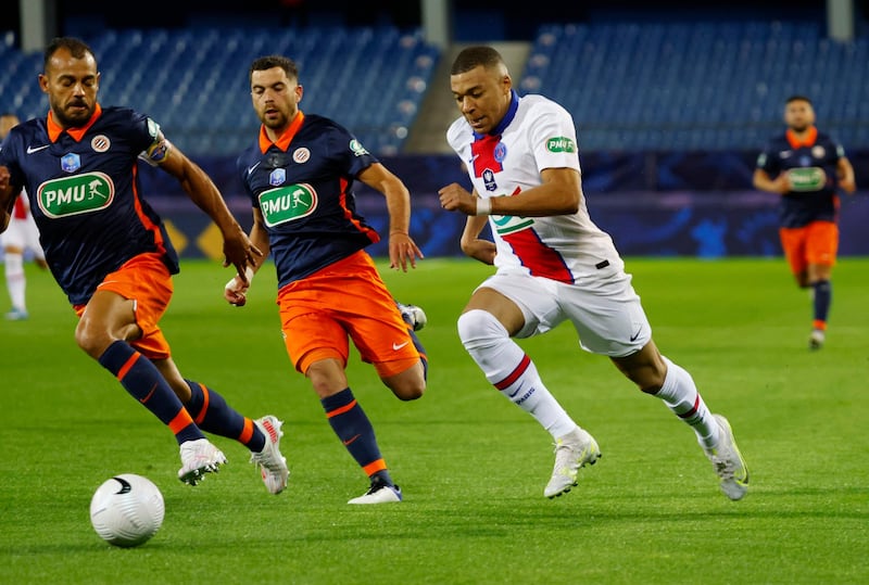 PSG's Kylian Mbappe in action with Montpellier's Hilton. Reuters