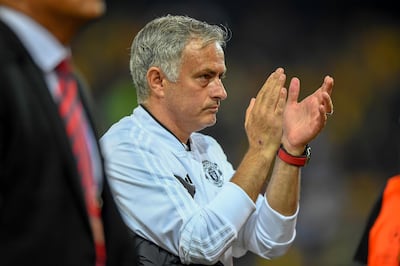 Manchester United's head coach Jose Mourinho applauds after the UEFA Champions League group H matchday 1 soccer match between Switzerland's BSC Young Boys and England's Manchester United FC in the Stade de Suisse in Berne, Switzerland, on Wednesday, September 19, 2018. (Anthony Anex/Keystone via AP)