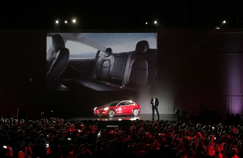 Tesla Chief Executive Elon Musk introduces one of the first Model 3 cars off the Fremont factory's production line during an event at the company's facilities in Fremont, California, U.S., July 28, 2017.     REUTERS/Alexandria Sage