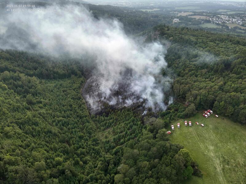 Firefighters battling a blaze in a forest near Saint-Goazec in Brittany, France. AFP