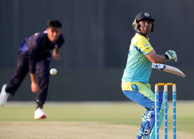 Abu Dhabi, United Arab Emirates - October 04, 2018: Defenders' Noor-ul-Haq Malekzai is hit in the back in the game between Auckland Aces and the Boost Defenders in the Abu Dhabi T20 competition. Thursday, October 4th, 2018 at Zayed Cricket Stadium, Abu Dhabi. Chris Whiteoak / The National
