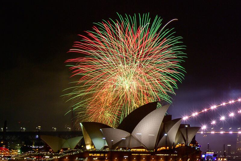 The 9pm 'family fireworks' explode over Sydney Opera House during New Year’s Eve celebrations in Sydney. AFP