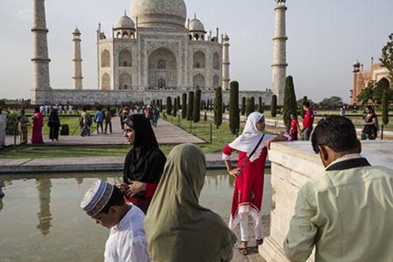 Indian and foreign tourists visit the Taj Mahal in Agra, India. Daniel Berehulak / Getty Images