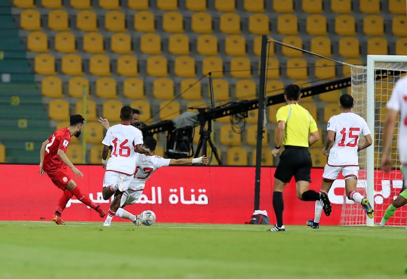 Bahrain's Mahdi Abduljabbar scores the opening goal against the UAE.