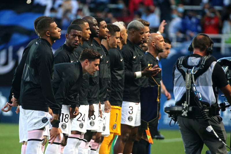 Paris Saint-Germain's French defender Presnel Kimpembe holds his hands open as he recites a Muslim prayer prior to the start of the French L1 match between Paris Saint-Germain (PSG) and ES Troyes.
