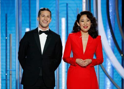 This image released by NBC shows hosts Andy Samberg, left, and Sandra Oh at the 76th Annual Golden Globe Awards at the Beverly Hilton Hotel on Sunday, Jan. 6, 2019, in Beverly Hills, Calif. (Paul Drinkwater/NBC via AP)