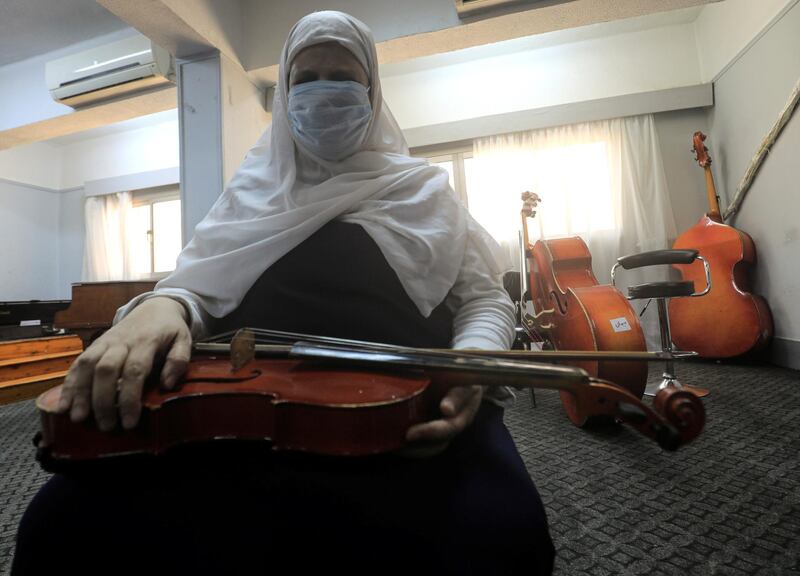 A member of Al Nour Wal Amal (Light and Hope) chamber orchestra for blind women plays during a practice session in Cairo, Egypt. Reuters