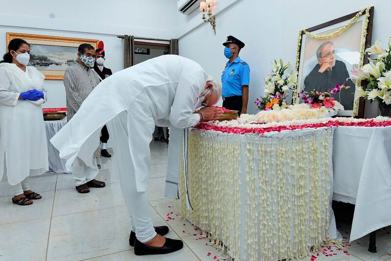 India's Prime Minister Narendra Modi pays his respects to Mukherjee. AFP