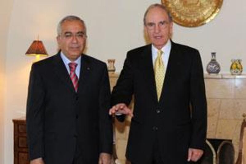 The US envoy George Mitchell, right, meets the Palestinian prime minister Salam Fayyad at the US Consulate in Jerusalem today.