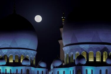 Abu Dhabi, United Arab Emirates, April 8, 2020. The Supermoon rises over the Sheikh Zayed Grand Mosque. Victor Besa / The National Section: NA Reporter: