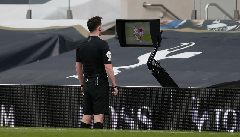 Referee Chris Kavanagh reviews the Edinson Cavani goal before disallowing it. PA