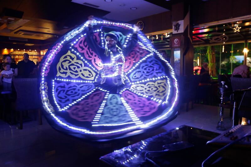 Dervish dancers perform at a restaurant in Damascus, Syria as part of their iftar customs during Ramadan. EPA