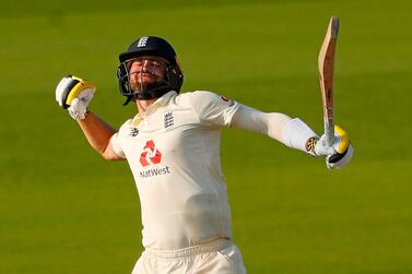 England's Chris Woakes celebrates after hitting the winning runs during play on the fourth day of the first Test cricket match between England and Pakistan at Old Trafford in Manchester, north-west England on August 8, 2020. England beat Pakistan by three wickets in 1st Test thriller. - RESTRICTED TO EDITORIAL USE. NO ASSOCIATION WITH DIRECT COMPETITOR OF SPONSOR, PARTNER, OR SUPPLIER OF THE ECB / AFP / POOL / LEE SMITH / RESTRICTED TO EDITORIAL USE. NO ASSOCIATION WITH DIRECT COMPETITOR OF SPONSOR, PARTNER, OR SUPPLIER OF THE ECB