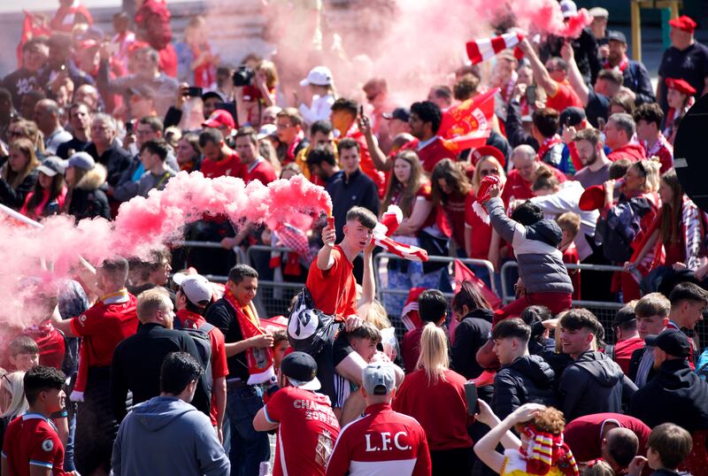 Liverpool fans wait at the pier head ahead of the trophy parade. PA