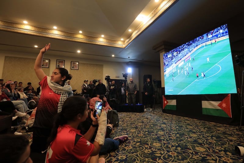 Jordanians watch the match on big screens in Amman