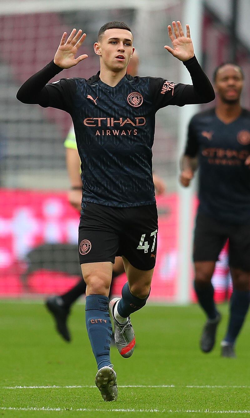 City's Phil Foden celebrates scoring. AFP